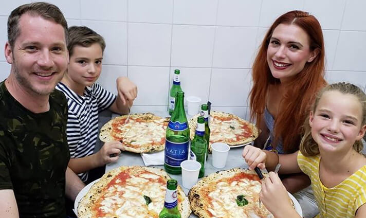 Cox family eating pizza in Rome