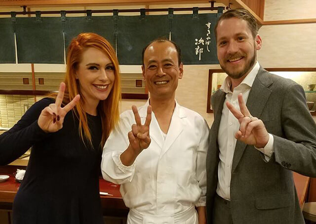 Bree and Jason pose with a chef in Tokyo