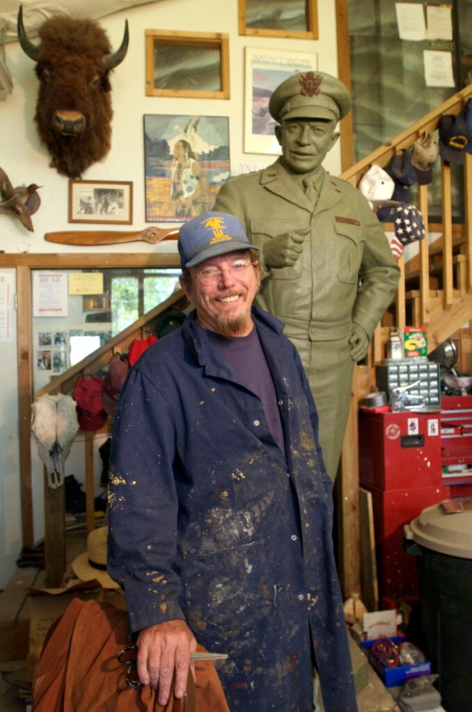 Sculptor Jim Brothers next to Eisenhower mold