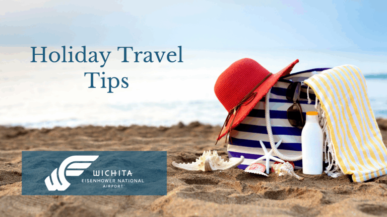 Text says Holiday Travel Tips; image is of a sandy beach with a blue and white striped back with a red hat, sunglasses, and yellow and white striped towel on it. A white water bottle with a yellow lid and seashells are sat in front of the bag.